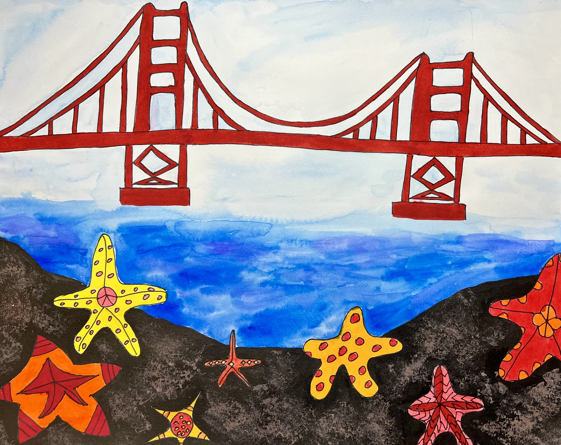 Starfish are in foreground, the Golden Gate Bridge in background