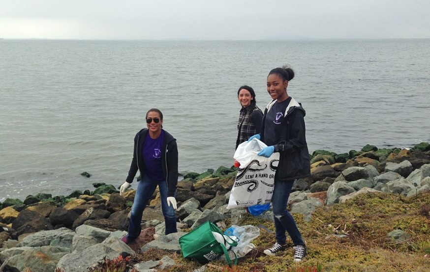 Women cleaning up the shoreline