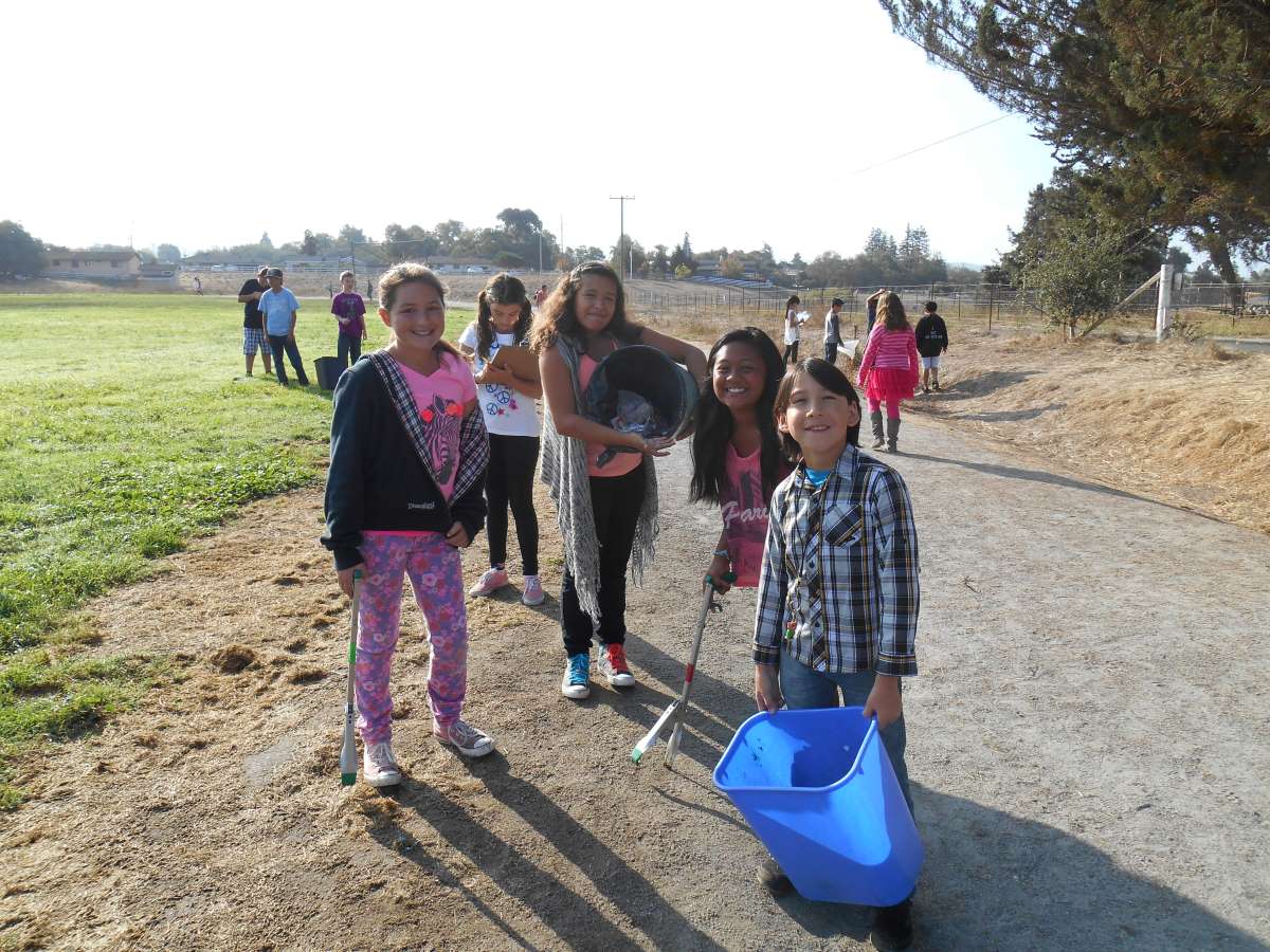 kids cleaning their schoolyard