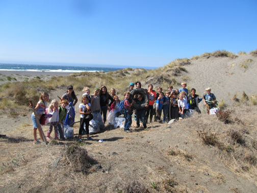 Group of students in the dunes after a beach cleanup