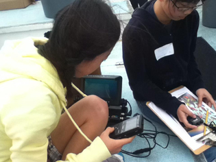 Students use an underwater Fish Cam to view sea life in the kelp beds.