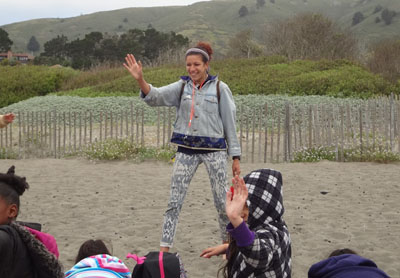 Instructor leading kids at the beach
